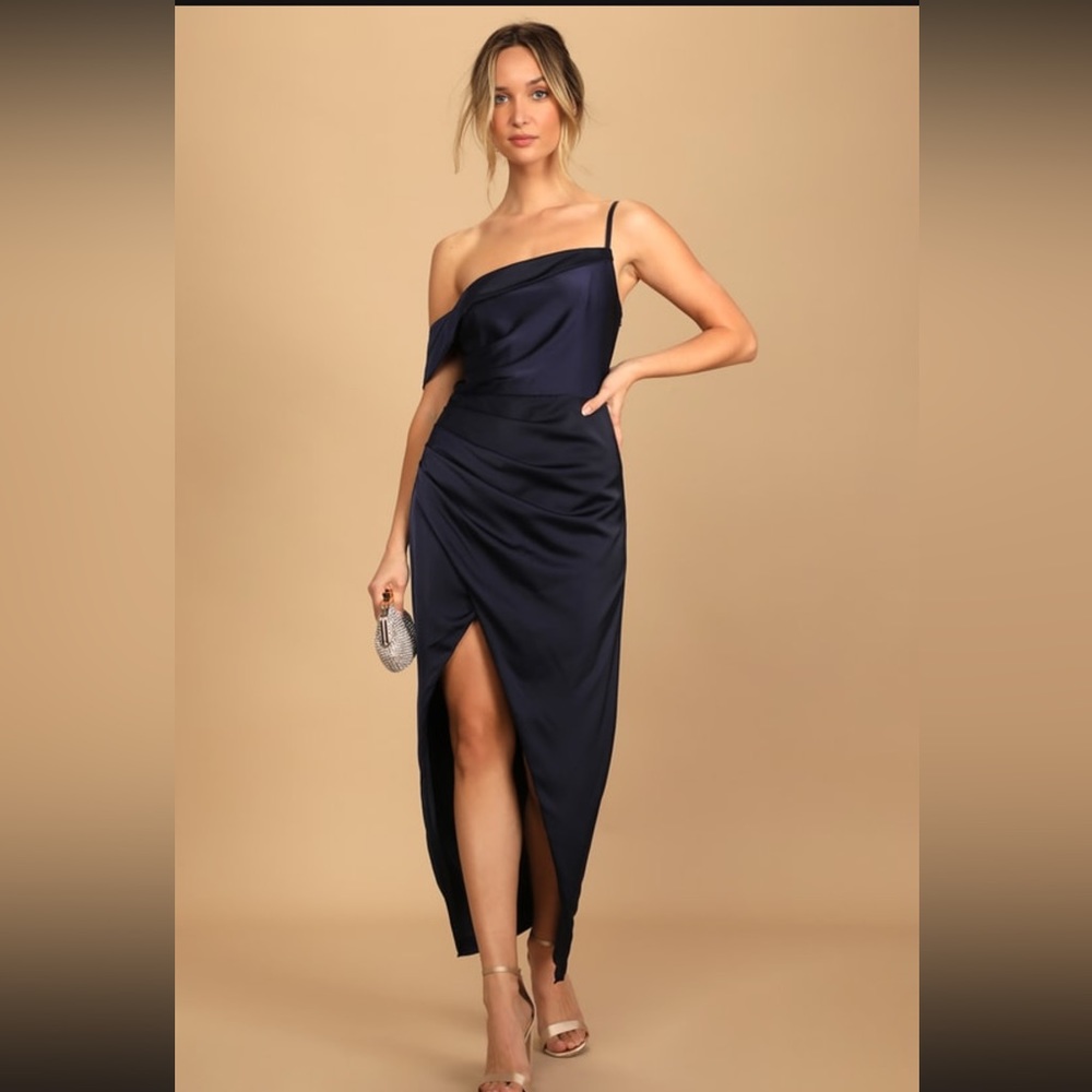 NEVER WORN. TAG STILL ATTACHED NAVY BLUE OFF THE SHOULDER DRESS. SIZE MEDIUM